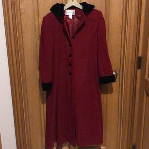 red hooded coat with black faux fur cuffs hood